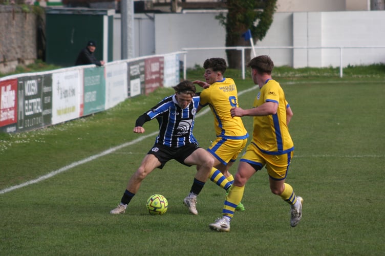 Spurs forward Callum Noyce being paid close attention