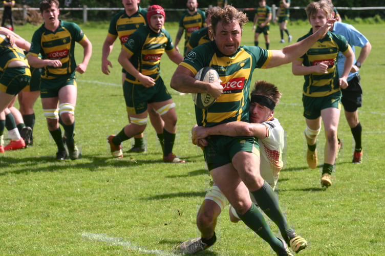 Barney Stancombe with a big tackle for the All Whites