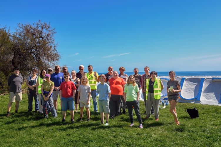Twenty volunteers helped to repaint the Teignmouth Letters. Photo David Caunter 