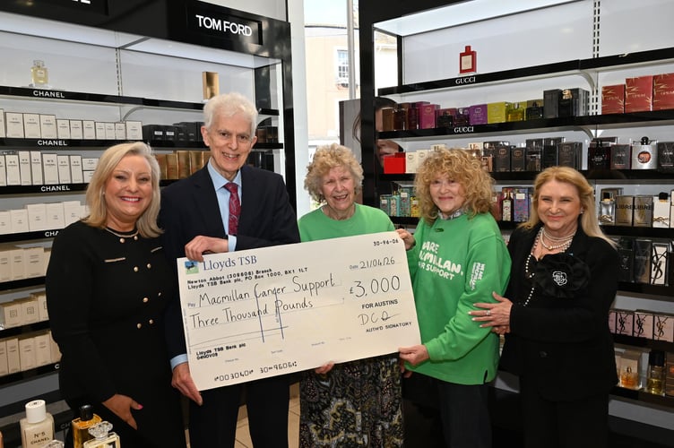 Cheque presentation to Macmillan Cancer Support from Austins Department Store in Newton Abbot. From left: Sam Kenyon, David Austin, Joy Thomas, Janet Greensmith and Sharon Lobley.