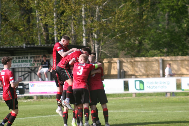 Bovey players celebrate their fourth against Ilminster