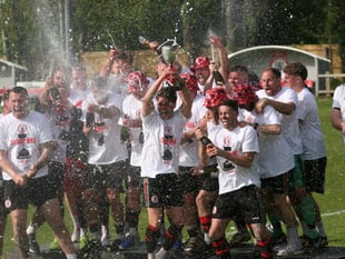 Bovey Tracey AFC hoist league title aloft