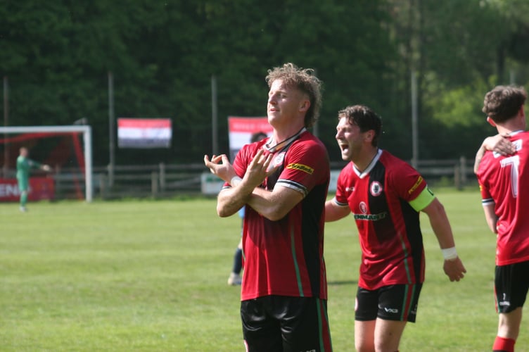 Levi Landricombe celebrates scoring Bovey's equaliser