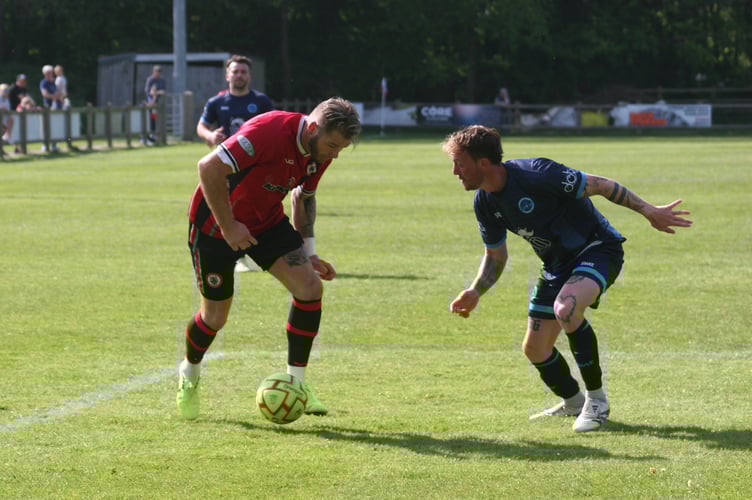 Bovey's Stuart Bowker looks to beat his man.