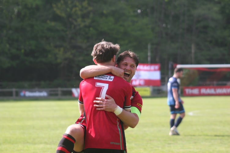 Cliff Walters celebrates Bovey's opener with Jack Brimming