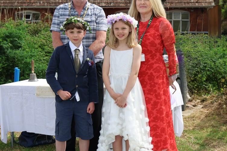 Cockwood Primary School's May King and Queen, Wilbur and Georgia, with Dawlish Mayor Cllr Anthony James and Head of School Alison Roper. Photo:  Bob Simpson