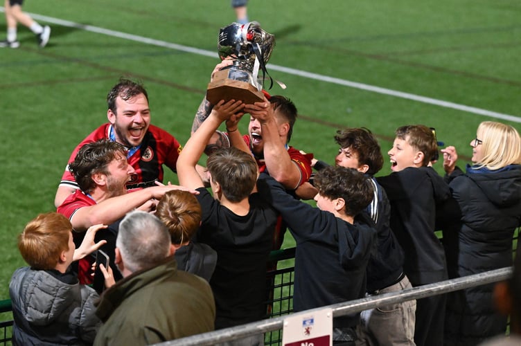 Bovey players celebrate with young fans