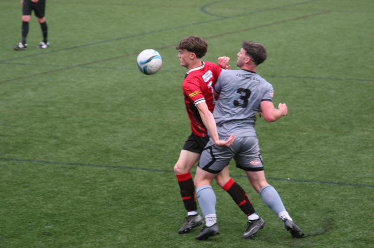 Jack Brimming being shown close attention