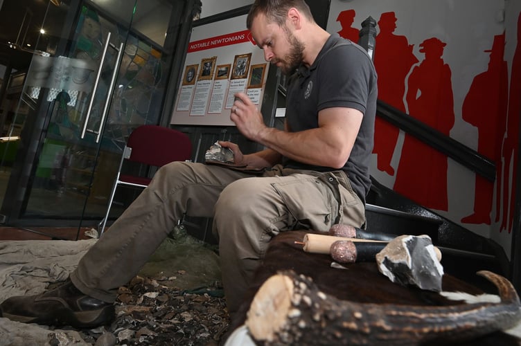 Teignbridge Archaeological Society archaeology fair at Newton Abbot Town Hall, Flint knapping demonstration from Jono Holland