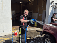 Firefighters raise hundreds for charity with car wash