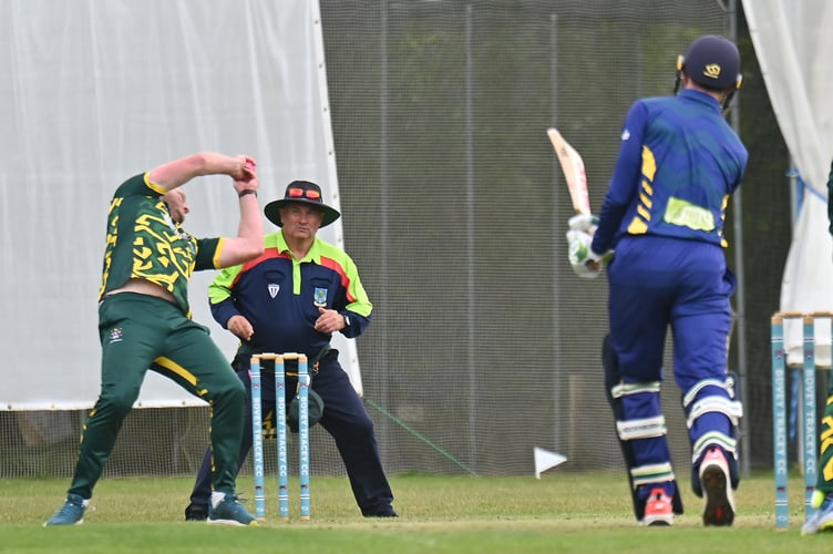 Devon Cricket League A Division, Bovey Tracey versus Kilmington. Bovey bowler Peter Bradley defly catches the ball he's just lobbed down to Sam Farrow - who obligingly hit it straight back to him