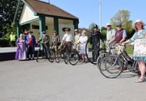 Penny Farthing riding policeman joines vintage bike ride