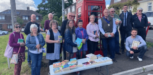Old phone box transformed into mini library 
