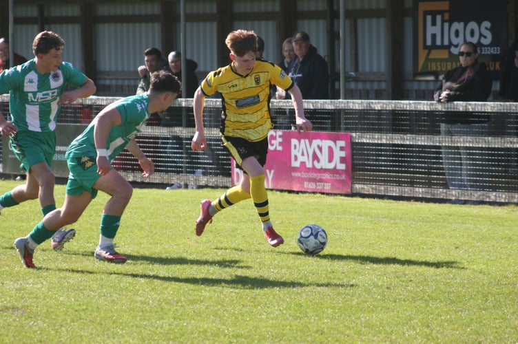 Buckland's Isaac McCue on the ball against Helston