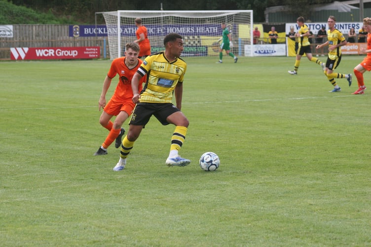 Myles James in possession for Buckland against Wellington