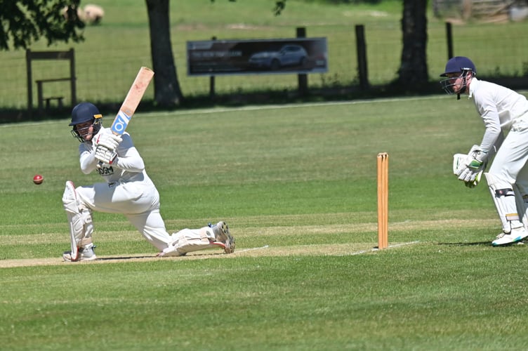 Devon Cricket League C Division West. Abbotskerswell versus South Devon. A 42 run win for Abbots who took to the crease first making 200 all out. South Devon's response after tea was 158 all out. Abbots' batsman Thomas Heath sends the ball to the boundary - watched by S Devon 'keeper Fin Humphreys