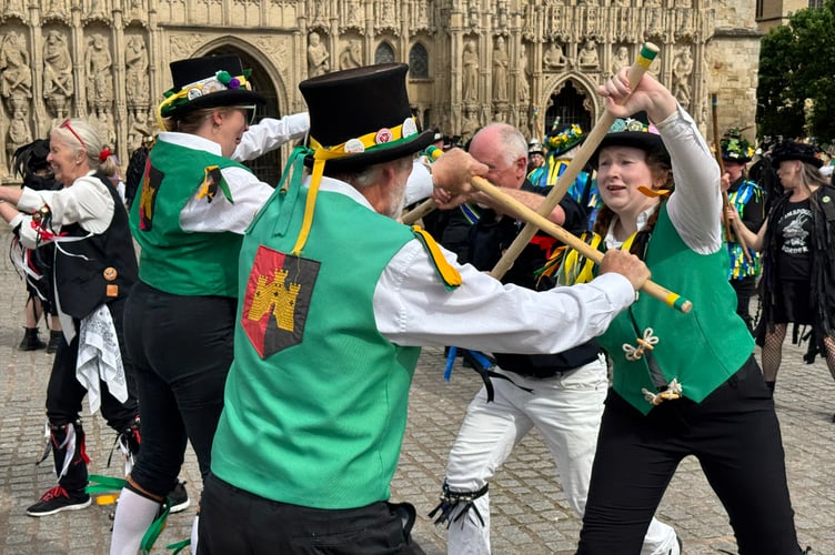During one of the dances, sticks in use. AQ 2372

