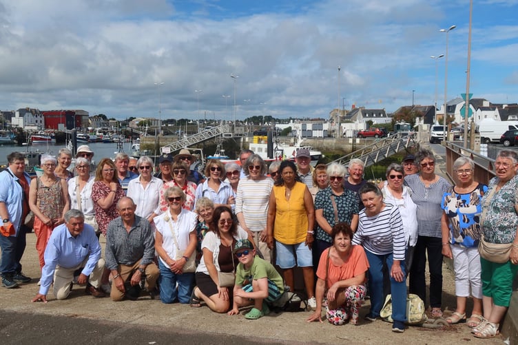 Dawlish Twinning Association with their French hosts at Léchiagat harbour on their way to a traditional mariners’ pub. Photo Alison Thomas