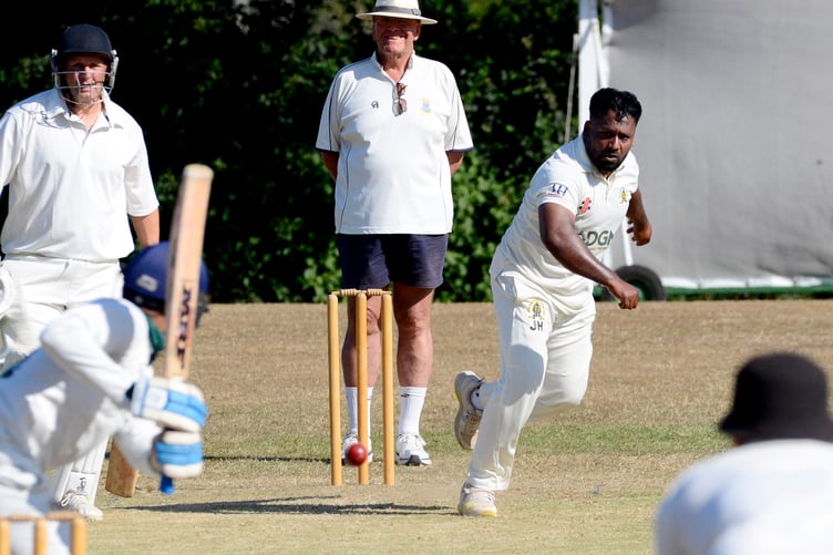 Abbotskerswell's all-action seamer Jay Hussain running down the hill to bowl at Plymouth batsman Aziz Rahmanzai. The villagers lost by five wickets