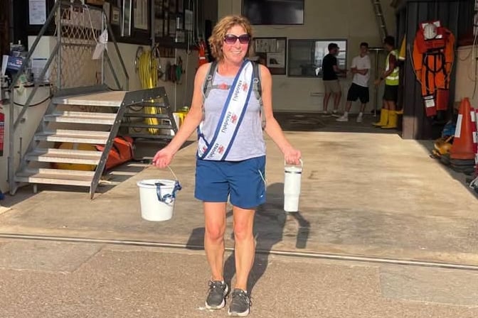Charlotte Burry with her collection buckets at Teignmouth RNLI
