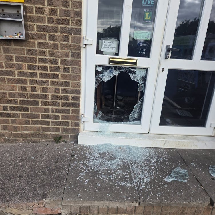 Smashed door at Shooters in Dawlish. Photo Shooters