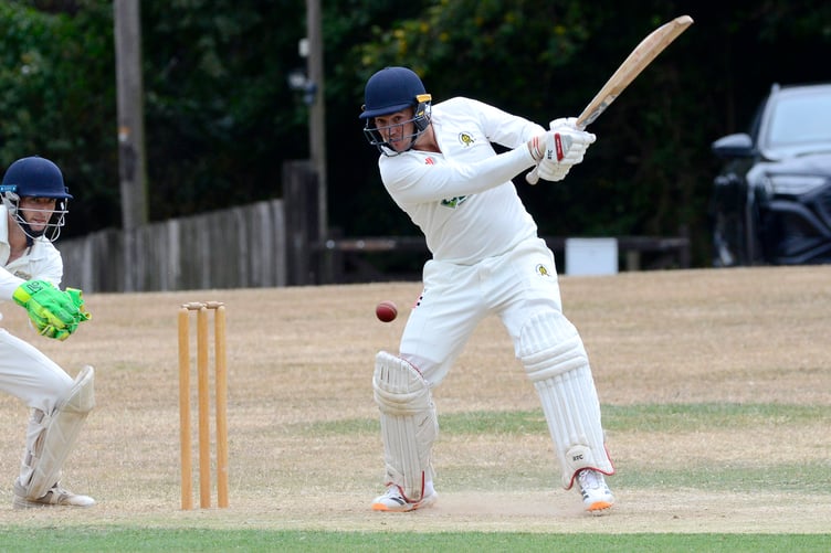 Tom Heath squirrs the Cornwood bowling through cover-point while contributing 28 runs to Abbotskerswell's run chase