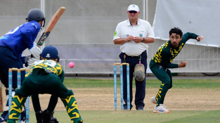 Bovey Tracey's Hem Chetri bowling to Heathcoat's James Gregson during the late battering when 80 runs were added in the last 10 overs of the innings