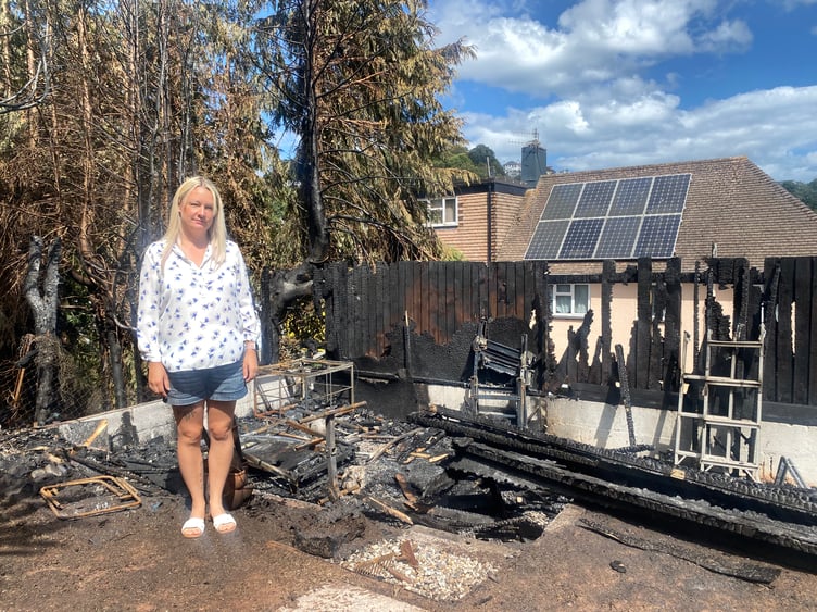 Charlotte Foster with the burned-out wreckage of her shed in Coleman Avenue, Teignmouth