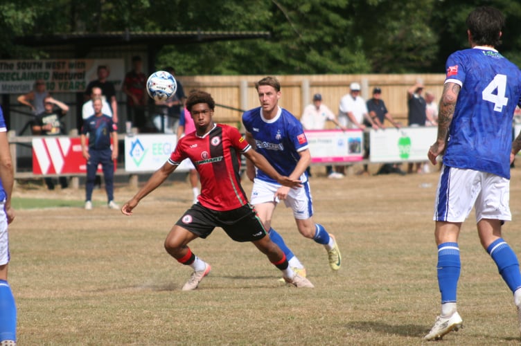 Bovey's Jadore Lawson with eyes on the ball against Exmouth