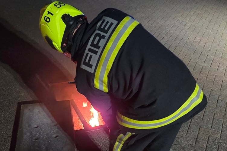 Firefighter uses a CO2 extinguisher on the blaze. Photo: Newton Abbot Fire Station