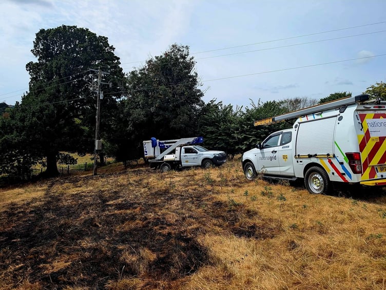 National Grid engineers at the scene of an electrical pole fire tackled by Buckfastleigh firefighters