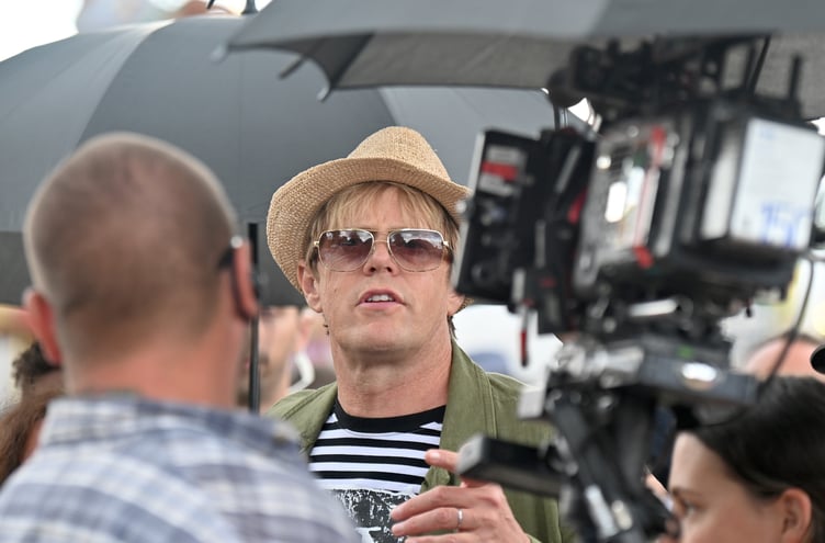 Beautiful Days music festival at Escot Park. Actor Kris Marshall filming an episode of Beyond Paradise at the event
