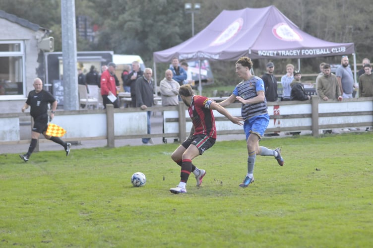Bovey's Owen Stockton gets himself between ball and man