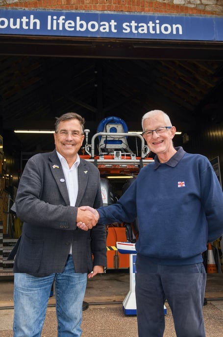 Newton Abbot MP Martin Wrigley with one of Teignmouth RNLI's fundraising volunteers at the lifeboat station