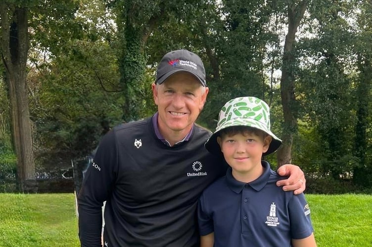 Harrison Grainger with playing partner Luke Donald