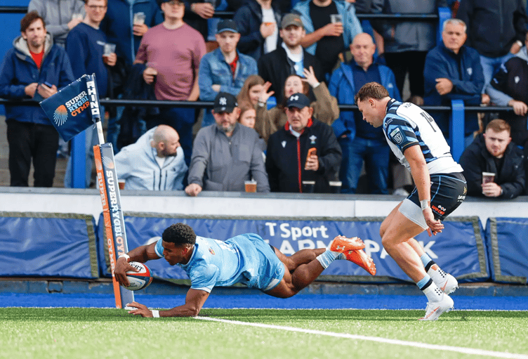 Exeter Chiefs winger Immanuel Feyi-Waboso crosses for a try in his side's pre-season win at Cardiff