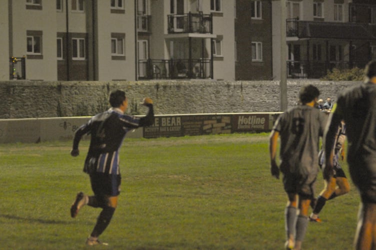 Spurs goalscorer Jordan Hogan wheels away in celebration