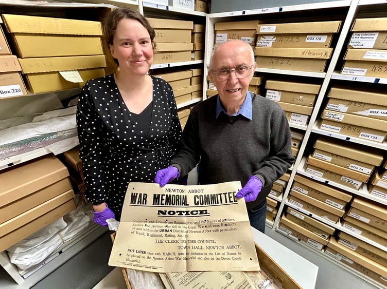 John Ellis and Joanna Eccles with the 1920 public notice that gave grieving families just two weeks to make their nominations to have names included on the memorial.