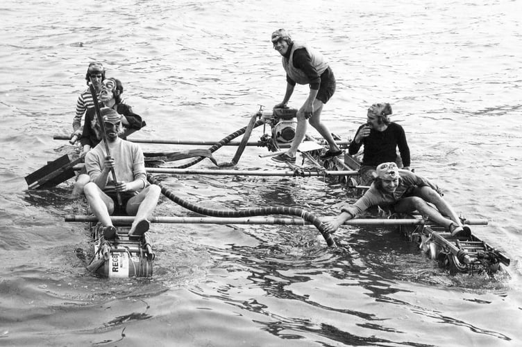 Getting that sinking feeling - one of he teams taking part in the 1972 Dawlish Carnival Raft Race