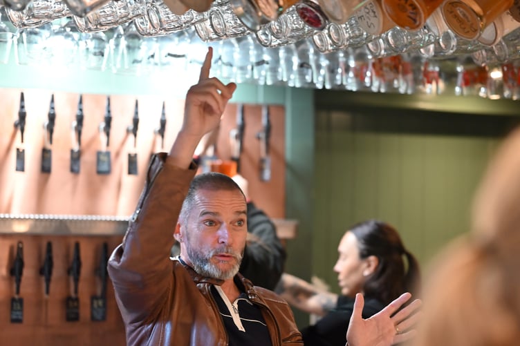 Pot spotting - Fred Sirieix searches for the correct jar for one of the Olde Cider Bar's regulars.. Photo Steve Pope